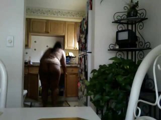 Black chick does the dishes in panties