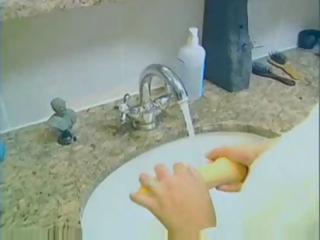 Busty blonde MILF sucks and gets screwed for cumshot in bathroom